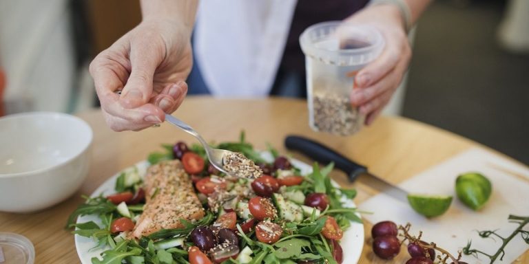 closeup-of-a-woman-preparing-a-salmon-salad.jpg