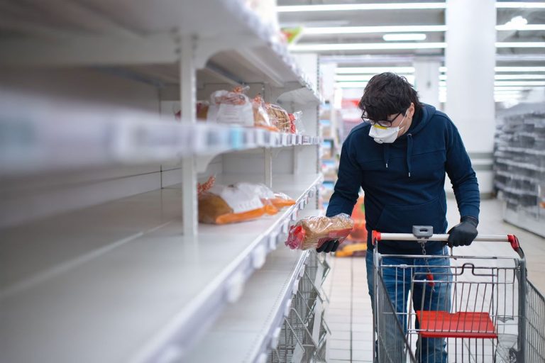 man_shopping_supermarket_during_pandemic_1217226532.jpg